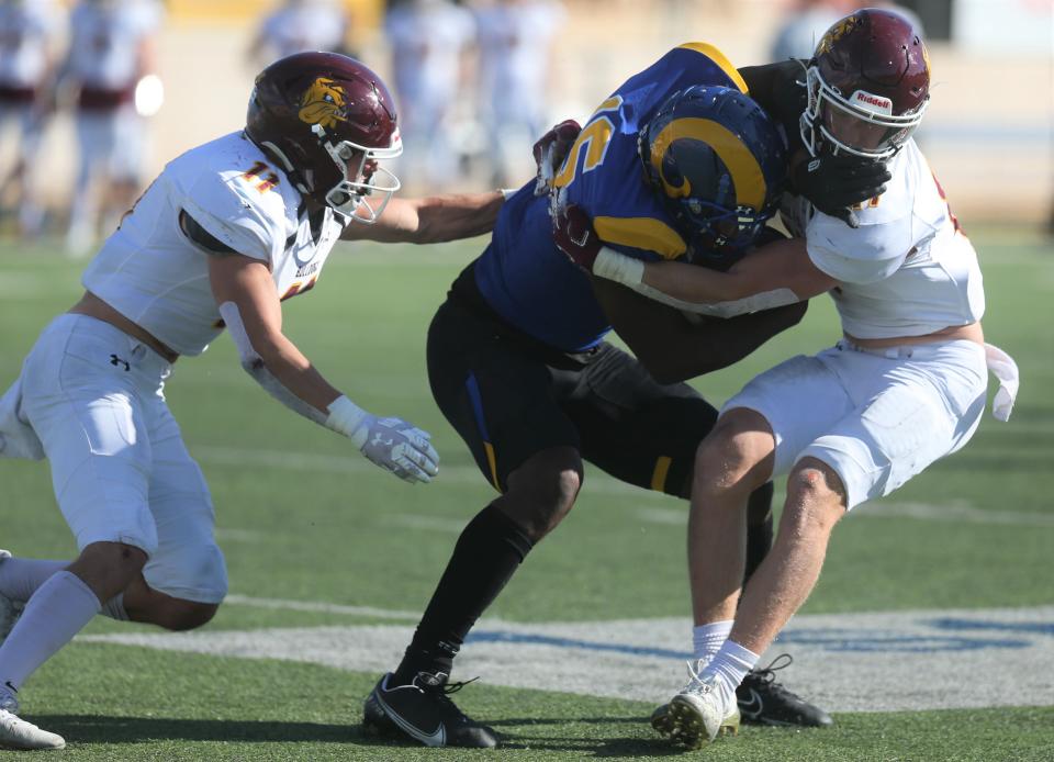 Angelo State University wide receiver Noah Massey gets wrapped up by the defense during an NCAA Division II first-round playoff game against Minnesota-Duluth at LeGrand Stadium at 1st Community Credit Union Field on Saturday, Nov. 20, 2021.