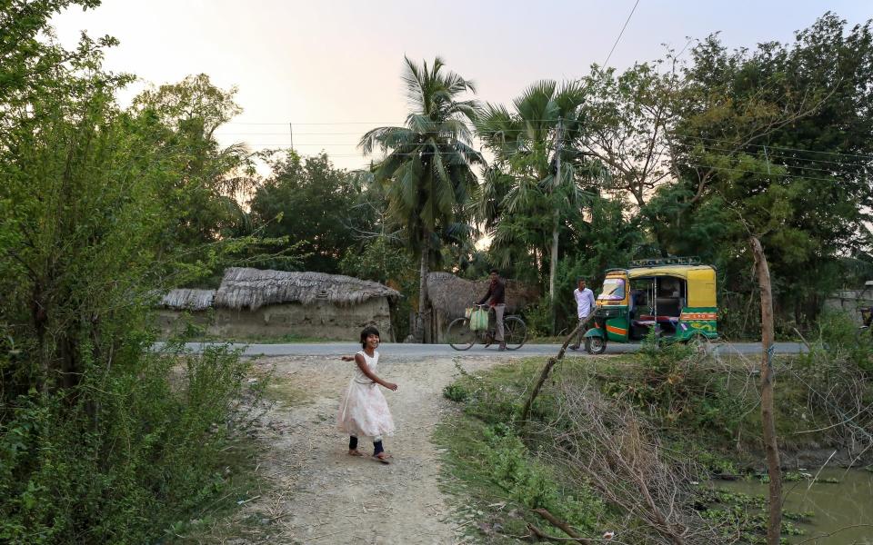 Rumana's daughter plays outside her house in Goran Bose, West Bengal - Catherine Davison