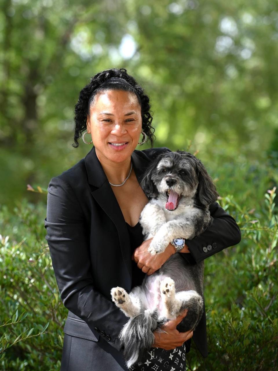 University of South Carolina head women’s basketball coach Dawn Staley and Champ on Monday, August 20, 2022 in Columbia, SC. Staley won numerous awards during her playing career including three Olympic gold medals and is a member of the Basketball Hall of Fame. As a coach, Staley has lead two team’s to the NCAA Division I championship. JEFF SINER/jsiner@charlotteobserver.com