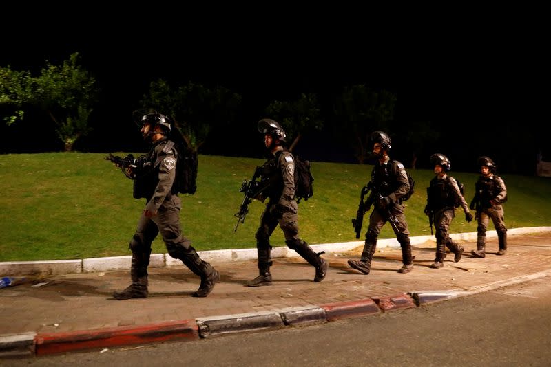 FILE PHOTO: Israeli Border Police force members patrol near the entrances to the Arab-Jewish town of Lod, Israel