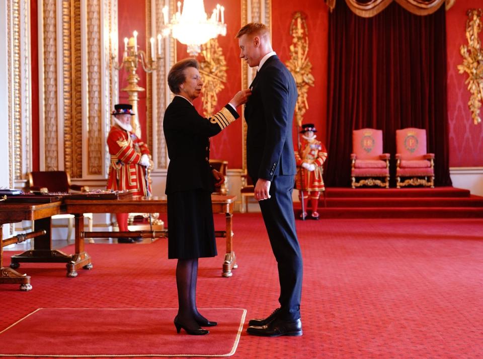 Tom Dean is made an MBE by the Princess Royal at Buckingham Palace (Yui Mok/PA) (PA Media)