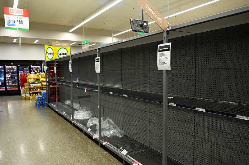 Empty shelves left after customers stocked up on toilet paper amid coronavirus fears are seen in a grocery store in Sydney