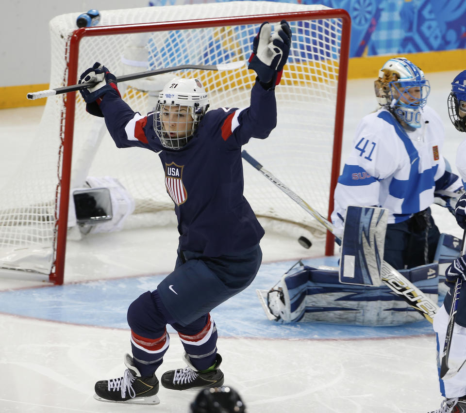 Hilary Knight of the Untied States celebrates her goal as Goalkeeper Noora Raty of Finland looks on during the women's ice hockey game at the Shayba Arena during the 2014 Winter Olympics, Saturday, Feb. 8, 2014, in Sochi, Russia. (AP Photo/Petr David Josek)