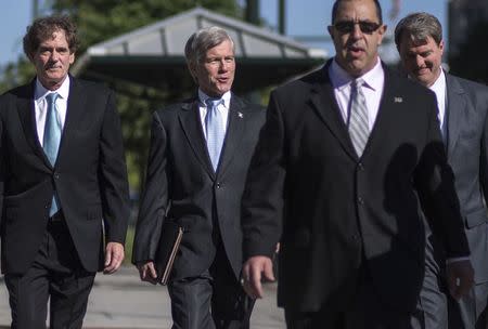 Former Virginia Governor Robert McDonnell arrives with his legal team for his trial in Richmond, Virginia, July 28, 2014. REUTERS/Jay Westcott