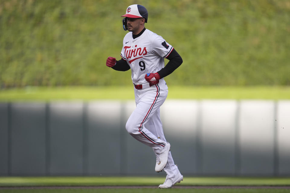 Minnesota Twins' Trevor Larnach runs the bases after hitting a solo home run against the Seattle Mariners during the first inning of a baseball game Wednesday, May 8, 2024, in Minneapolis. (AP Photo/Abbie Parr)