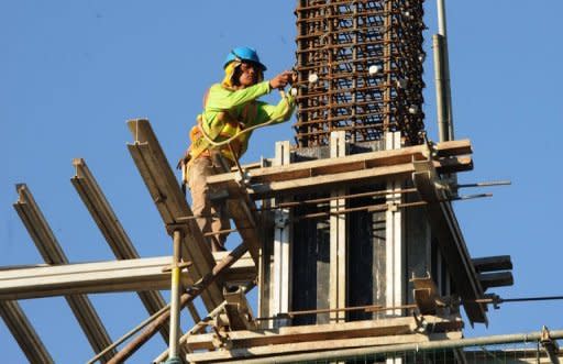 A construction worker at a building site for Bonifacio Global City in suburban Manila. The outsourcing workforce grew about 10 percent this year to 600,000, and is expected to expand to 900,000 employees by 2016