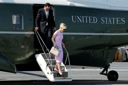 FILE PHOTO: U.S. Treasury Secretary Steve Mnuchin and his wife Louise Linton arrive on the Marine One helicopter with President Donald Trump aboard the deck of the aircraft carrier USS Gerald R. Ford for its commissioning ceremony at Naval Station Norfolk in Norfolk, Virginia, U.S. July 22, 2017. REUTERS/Jonathan Ernst/File Photo