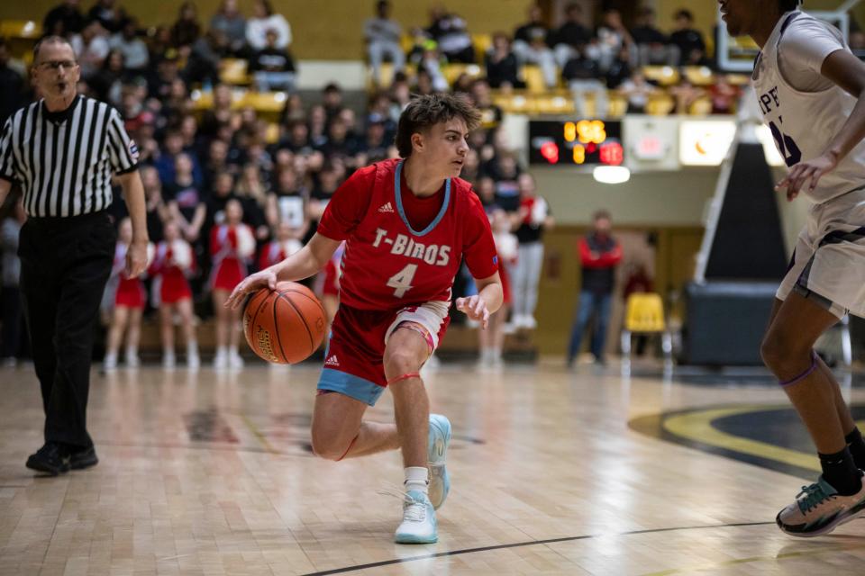 Shawnee Heights' Dylan Sanchez looks for an opening against Piper Wednesday, March 6 at Emporia.