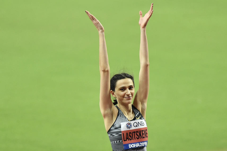 Mariya Lasitskene, participating as a neutral athlete, celebrates after winning the gold medal in the women's high jump final during the World Athletics Championships in Doha, Qatar, Monday, Sept. 30, 2019. (AP Photo/Martin Meissner)