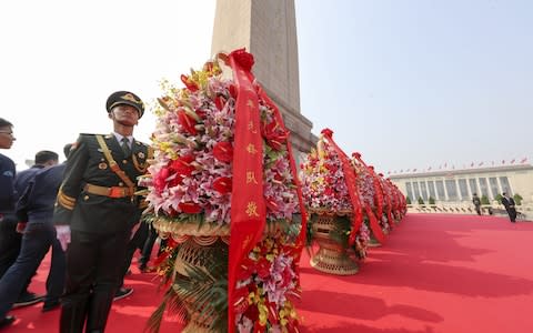 Flower baskets have been presented to deceased national heroes - Credit: VCG/VCG via Getty Images