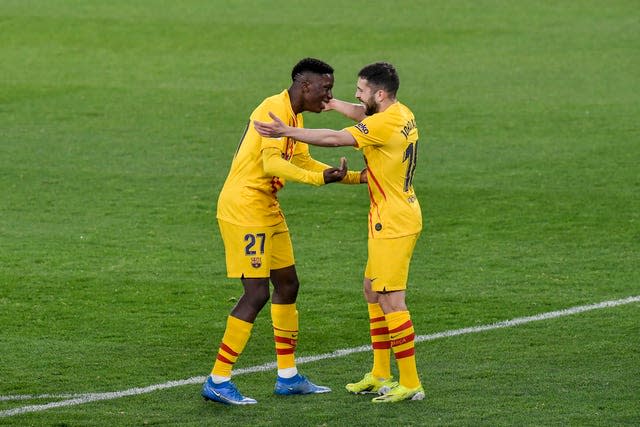 Barcelona's Ilaix Moriba (left) celebrates with his team-mate Lionel Messi after scoring