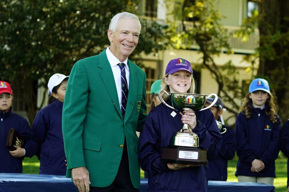 Apr 7, 2024; Augusta, Georgia, USA; Masters Champion Larry Mize poses for a picture with girls 7-9 overall winner Madison Pyatt during the Drive, Chip & Putt National Finals competition at Augusta National Golf Club. Mandatory Credit: Katie Goodale-USA TODAY Sports