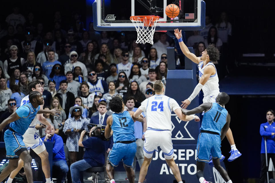 Xavier guard Colby Jones (3) shoots a lay-up during the first half of an NCAA college basketball game against Georgetown, Saturday, Jan. 21, 2023, in Cincinnati. (AP Photo/Joshua A. Bickel)