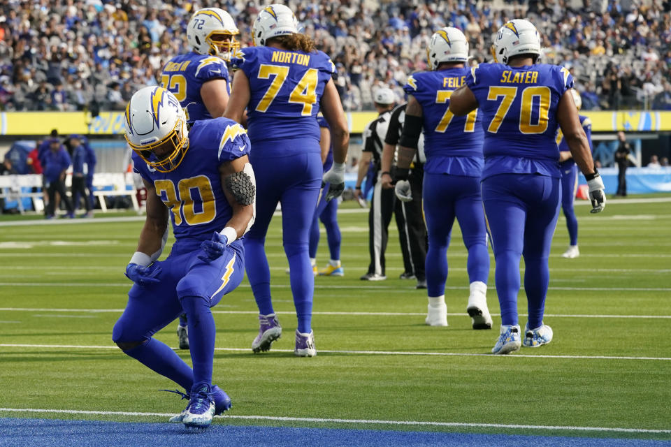 Los Angeles Chargers running back Austin Ekeler (30) celebrates after scoring during the first half of an NFL football game against the New York Giants Sunday, Dec. 12, 2021, in Inglewood, Calif. (AP Photo/Gregory Bull)