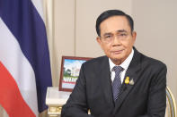 In this photo released by Government House, Thai Prime Minister Prayuth Chan-ocha sits in his office at Government House in Bangkok, Thailand, Wednesday, Oct. 21, 2020. Prayuth on Wednesday pleaded with his countrymen to resolve their political differences through Parliament, as student-led protests seeking to bring his government down continued for an eighth straight day. (Government House via AP)