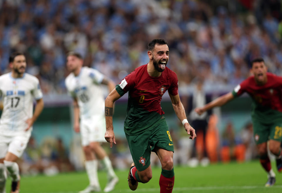 LUSAIL CITY, QATAR - NOVEMBER 28: Bruno Fernandes of Portugal celebrates scoring his team's second goal during the FIFA World Cup Qatar 2022 Group H match between Portugal and Uruguay at Lusail Stadium on November 28, 2022 in Lusail City, Qatar. (Photo by Amin Mohammad Jamali/Getty Images)