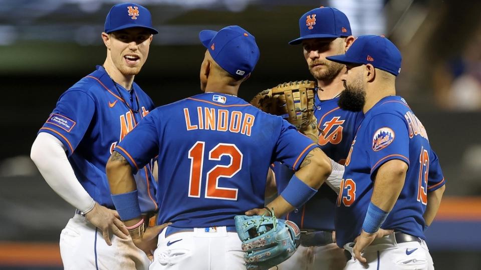 Jul 15, 2023; New York City, New York, USA; New York Mets third baseman Brett Baty (22) talks to shortstop Francisco Lindor (12) and first baseman Pete Alonso (20) and second baseman Luis Guillorme (13) during a pitching change during the ninth inning against the Los Angeles Dodgers at Citi Field.