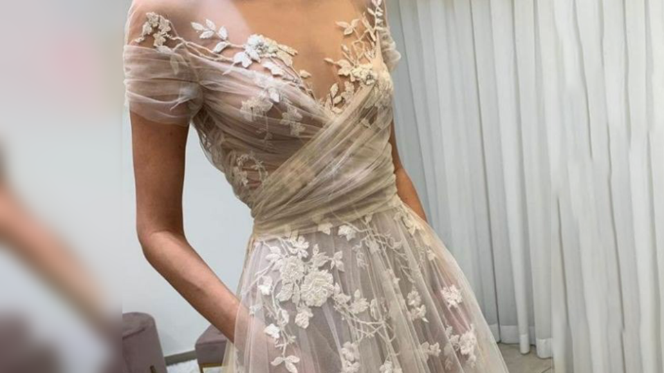 Wedding dress transparent exposes bride's nipples