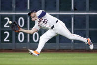 Houston Astros left fielder Chas McCormick makes a catch for the out on a fly ball by Los Angeles Angels' Willie Calhoun during the fifth inning of a baseball game Tuesday, May 21, 2024, in Houston. (AP Photo/Michael Wyke)