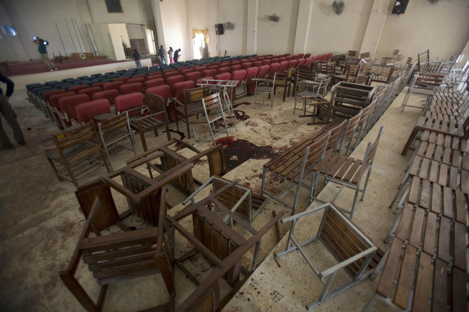 FILE - Chairs are upturned and blood stains the floor at the Army Public School auditorium a day after Pakistani Taliban gunmen stormed the school killing 150 people, in Peshawar, Pakistan, Dec. 17, 2014. Even as Pakistan leads the effort to get a reluctant world to engage with Afghanistan's new Taliban rulers, the insurgent movement has shown no signs of expelling Pakistani Taliban leaders from its territory, nor of preventing them from carrying out attacks in Pakistan. (AP Photo/B.K. Bangash, File)