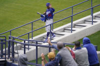 Los Angeles Dodgers right fielder Mookie Betts (50) waves to fans as he walks to the field before a spring training baseball game against the Milwaukee Brewers Tuesday, March 23, 2021, in Phoenix, Ariz. (AP Photo/Ashley Landis)