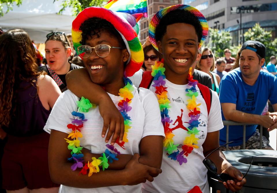 Alexis Sea of Price Hill and Shaniece Neal of Westwood wait for the start of the Cincinnati Pride Parade in 2017.