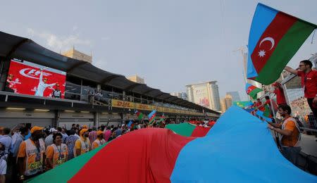 Formula One - Grand Prix of Europe - Baku, Azerbaijan - 19/6/16 - Supporters wave flags of Azerbaijan at the end of the race. REUTERS/Maxim Shemetov