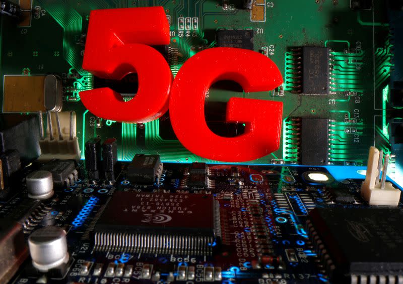 3d printed objects representing 5G are put on a motherboard in this picture illustration