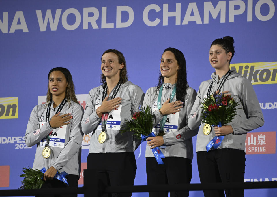 Gold medalist team of United States pose with their medals after the Women 4x200m Freestyle Relay final at the 19th FINA World Championships in Budapest, Hungary, Wednesday, June 22, 2022. (AP Photo/Anna Szilagyi)