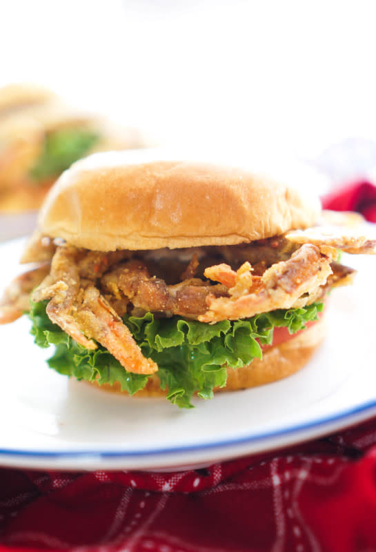 <p>Vodka and Biscuits</p><p>Maryland soft-shell crab battered in flour, cornmeal and milk then pan-fried to crispy perfection. Throw it on a sandwich with lettuce and tomato and you have yourself a treat!</p><p><strong>Get the recipe: <a href="http://www.vodkaandbiscuits.com/2016/08/15/crispy-soft-shell-crab-sandwich/" rel="nofollow noopener" target="_blank" data-ylk="slk:Crispy Soft Shell Crab Burgers;elm:context_link;itc:0;sec:content-canvas" class="link ">Crispy Soft Shell Crab Burgers</a></strong></p>