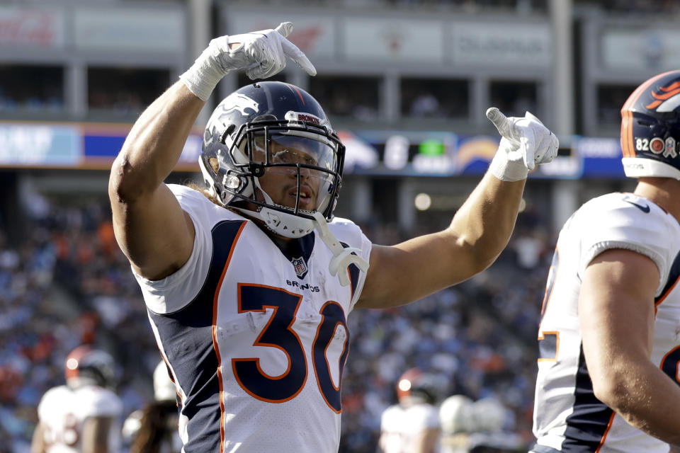 FILE - In this Sunday, Nov. 18, 2018, file photo, Denver Broncos running back Phillip Lindsay celebrates after scoring during the first half of an NFL football game against the Los Angeles Chargers in Carson, Calif. A terrific trio of rookies, including Lindsay, have led a turnaround from a 3-6 start to help Denver win three straight and get into the playoff picture. (AP Photo/Marcio Jose Sanchez, FIle)