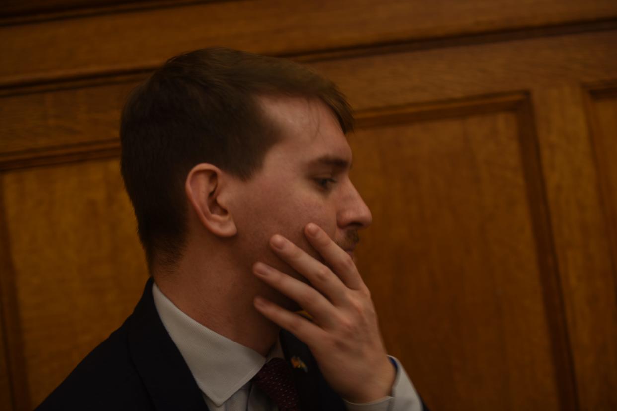 Gov. Kristi Noem's communications director, Ian Fury, sits in the press box in the South Dakota House of Representatives Tuesday while the governor delivered her 2021 Budget Address.