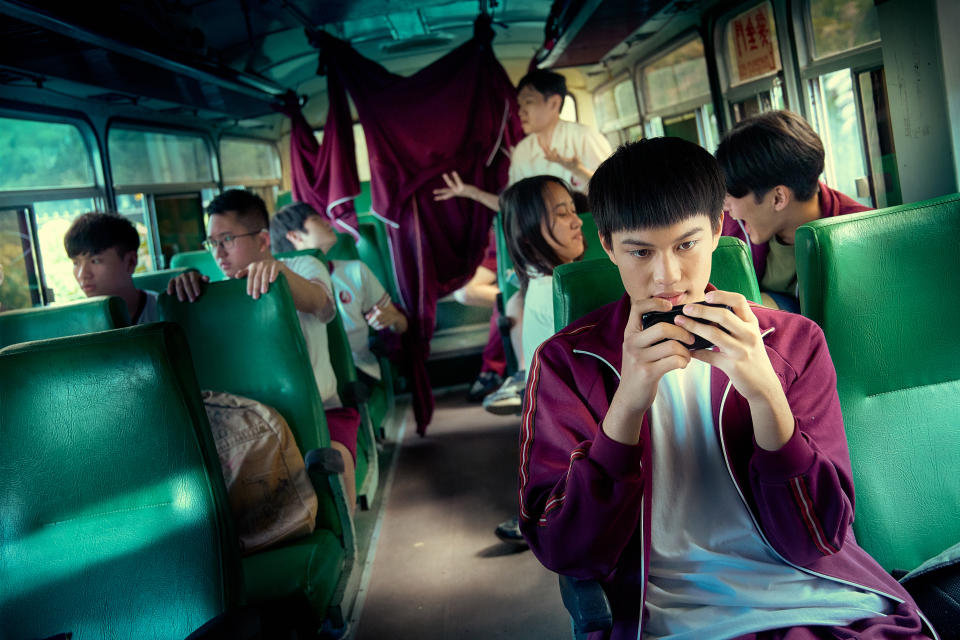 Liu Tzu-chuan as Chang Cheng, oblivious to the “game” taking place at the back of the bus in The Silent Forest. (Photo: mm2 Entertainment)