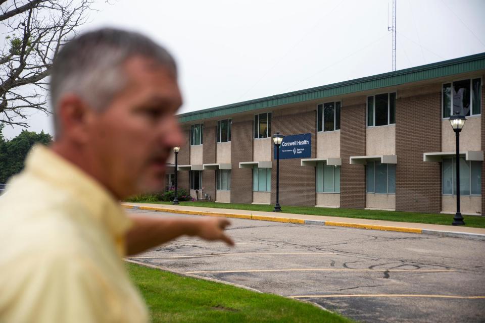 Lakeview City Manager Darin Dood points to the town's Kelsey Hospital on Aug. 25, 2023, The hospital closed Oct. 6.