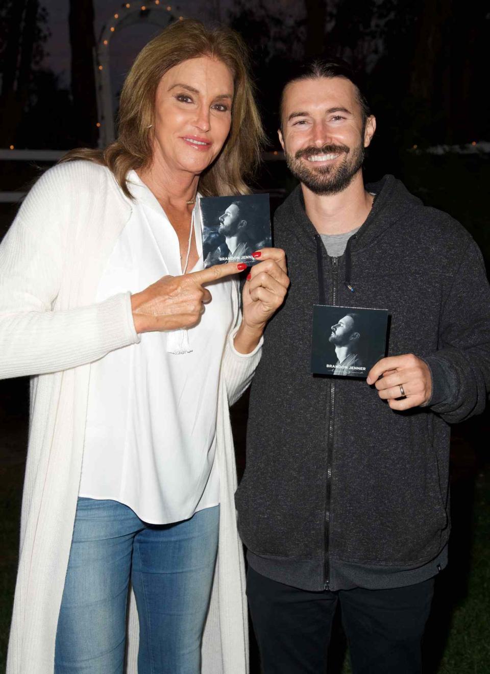 Caitlyn Jenner and Brandon Jenner pose for a photo at the Brandon Jenner Record Release Party For "Burning Ground" on November 19, 2016 in Malibu, California
