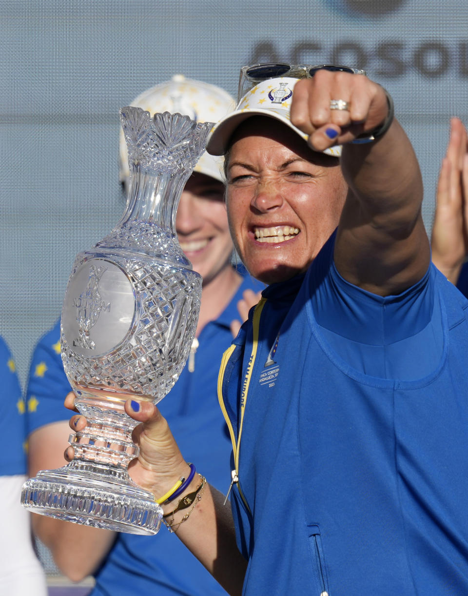 Europe's Team Captain Suzann Pettersen holds the trophy after wining the Solheim Cup golf tournament in Finca Cortesin, near Casares, southern Spain, Sunday, Sept. 24, 2023. Europe has beaten the United States during this biannual women's golf tournament, which played alternately in Europe and the United States. (AP Photo/Bernat Armangue)