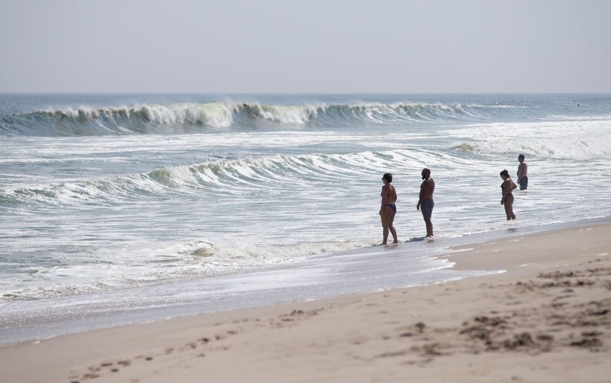 People watch large waves from the safety of the sand near 13th Avenue. Large surf continues to pound the coast up and down the Jersey Shore. Seaside Park has no lifeguards on duty and has warned people not to swim by posting signs.  
Seaside Park, NJ
September 5, 2023