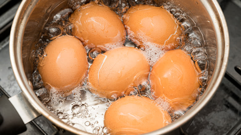 Eggs boiling in a pan