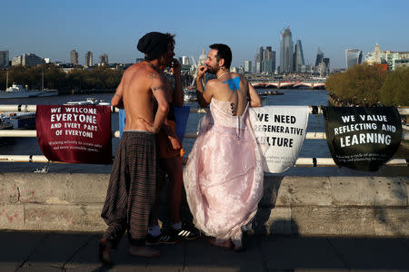 Protesters talk during the Extinction Rebellion protest on Waterloo Bridge in London, Britain April 20, 2019. REUTERS/Simon Dawson