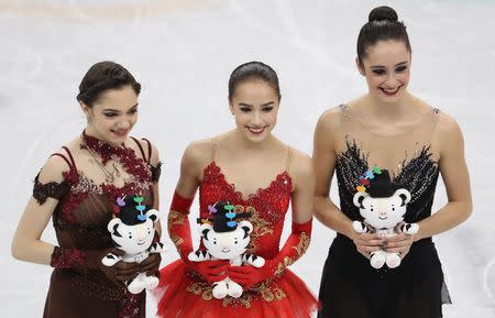 Figure Skating - Pyeongchang 2018 Winter Olympics - Women Single Skating free skating competition final - Gangneung Ice Arena - Gangneung, South Korea - February 23, 2018 - Gold medallist Alina Zagitova, an Olympic Athlete from Russia, silver medallist Evgenia Medvedeva, an Olympic Athlete from Russia, and bronze medallist Kaetlyn Osmond of Canada pose. REUTERS/Lucy Nicholson