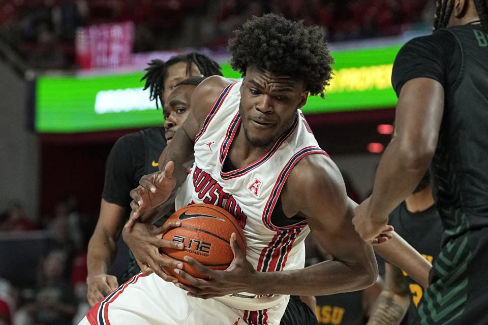 Houston forward Jarace Walker grabs an offensive rebound during the first half of an NCAA college basketball game against Norfolk State, Tuesday, Nov. 29, 2022, in Houston. (AP Photo/Kevin M. Cox)