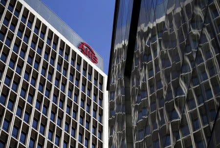 The logo of Asian Infrastructure Investment Bank (AIIB) is seen at its headquarter building in Beijing January 17, 2016.REUTERS/Kim Kyung-Hoon