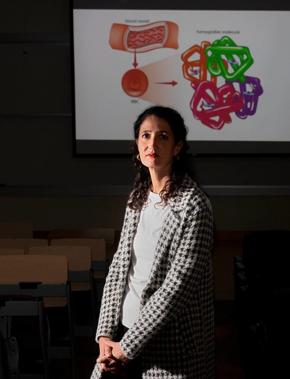 Kelly Hogan, a biology professor at Duke University, is photographed in a lecture hall on campus on Tuesday, Oct. 17, 2023, in Durham, N.C. Hogan, who taught for 18 years at UNC-Chapel Hill, will begin teaching at Duke next semester. Kaitlin McKeown/kmckeown@newsobserver.com