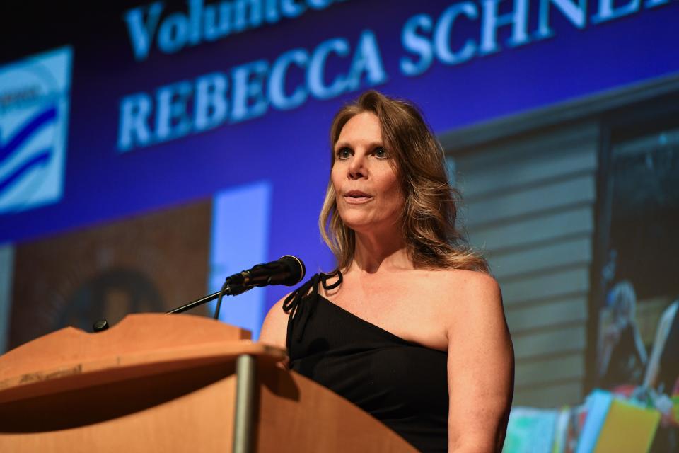 Rebecca Schneider thanks the audience after being awarded the 2023 Volunteer of the Year Award during the 2024 Raven Award ceremony on Wednesday, June 5, 2024, in Ravenna.