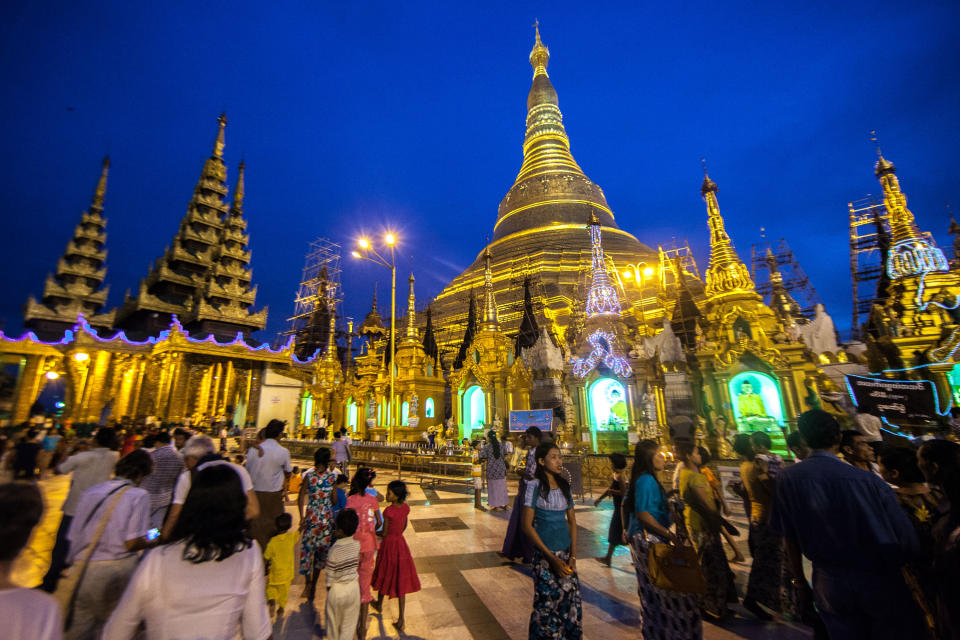 In this December 2012 photo crowds visit the Shwedagon Pagoda in Yangon, Myanmar. (AP Photo/Richard Camp)