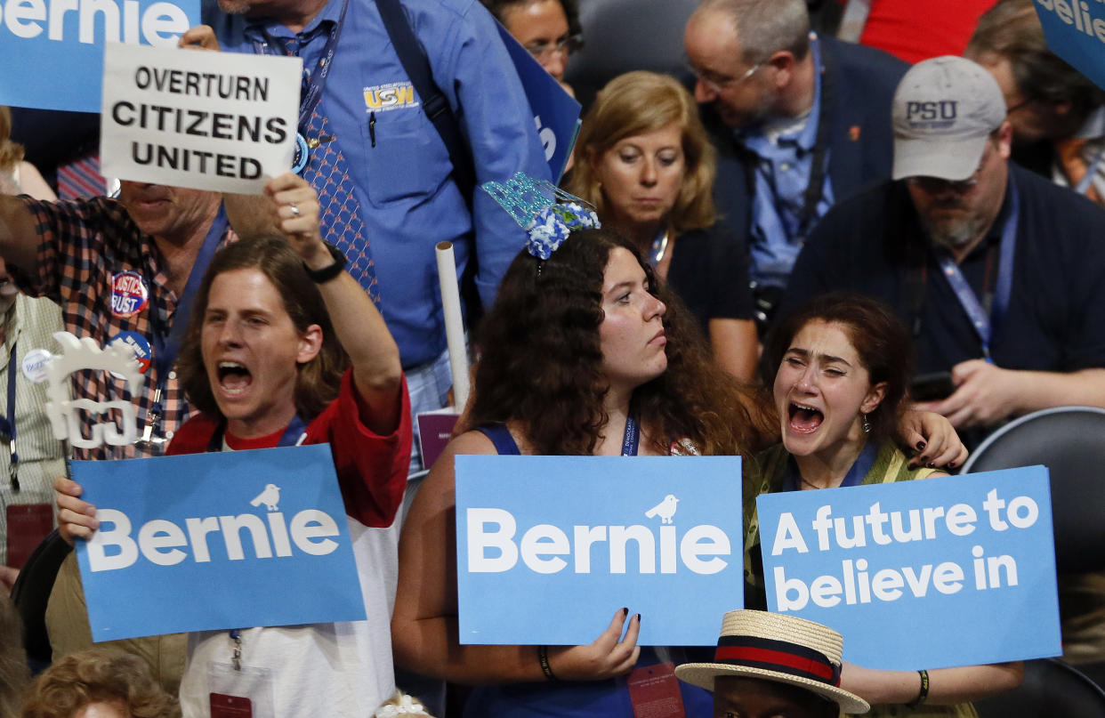 Supporters of Sen. Bernie Sanders (I-Vt.) listen to him speak during the Democratic National Convention in Philadelphia on Monday.