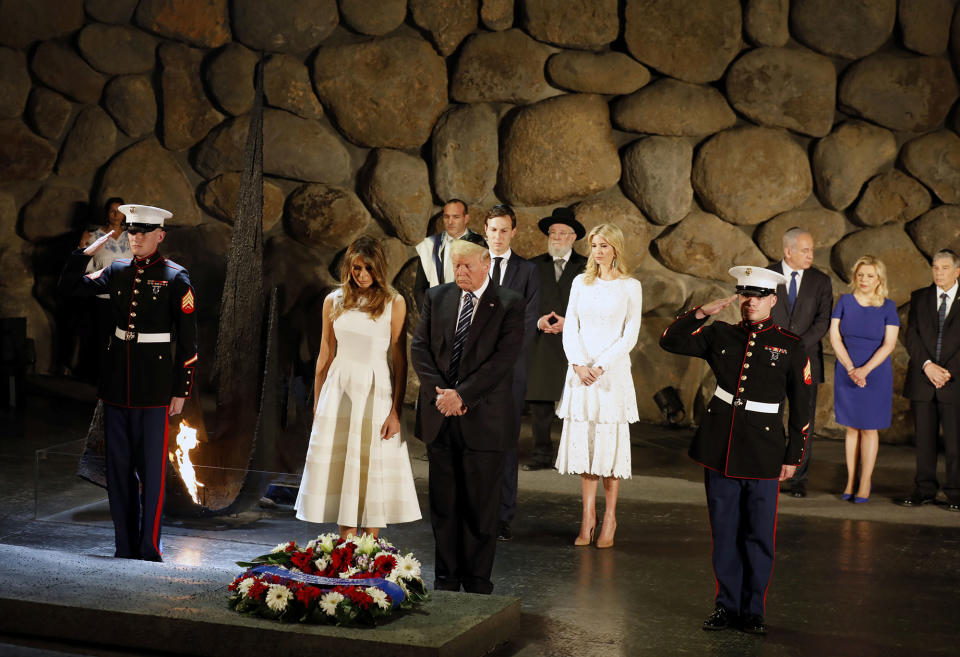 <p>White House senior advisor Jared Kushner, Ivanka Trump, first lady Melania Trump, U.S. President Donald Trump, Israel’s Prime Minister Benjamin Netanyahu (3rd L back), his wife Sara (2nd L) and Chairman of the Yad Vashem Holocaust Memorial, Avner Shalev, attend a wreath laying ceremony during a visit to the Yad Vashem Holocaust Memorial museum in Jerusalem May 23, 2017. (Gali Tibbon/Pool/Reuters) </p>