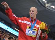 Canada's Brent Hayden smiles after he won silver in the final of the men's 100-metre freestyle swimming event in the FINA World Championships at the indoor stadium of the Oriental Sports Center in Shanghai on July 28, 2011. AFP PHOTO / PETER PARKS (Photo credit should read PETER PARKS/AFP/Getty Images)