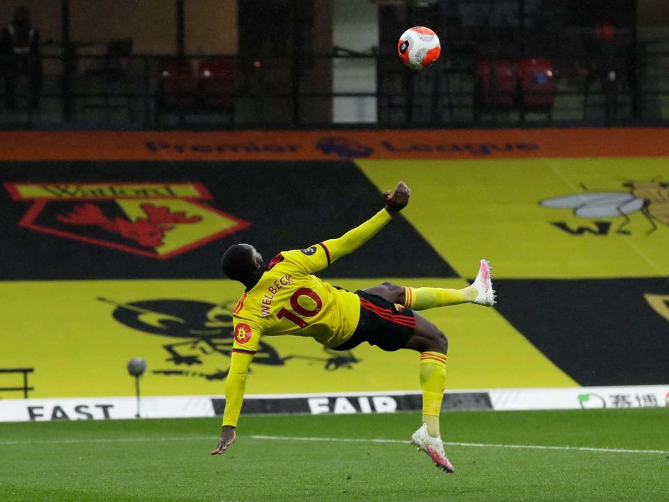 Danny Welbeck sets himself to score with an overhead kick: Getty