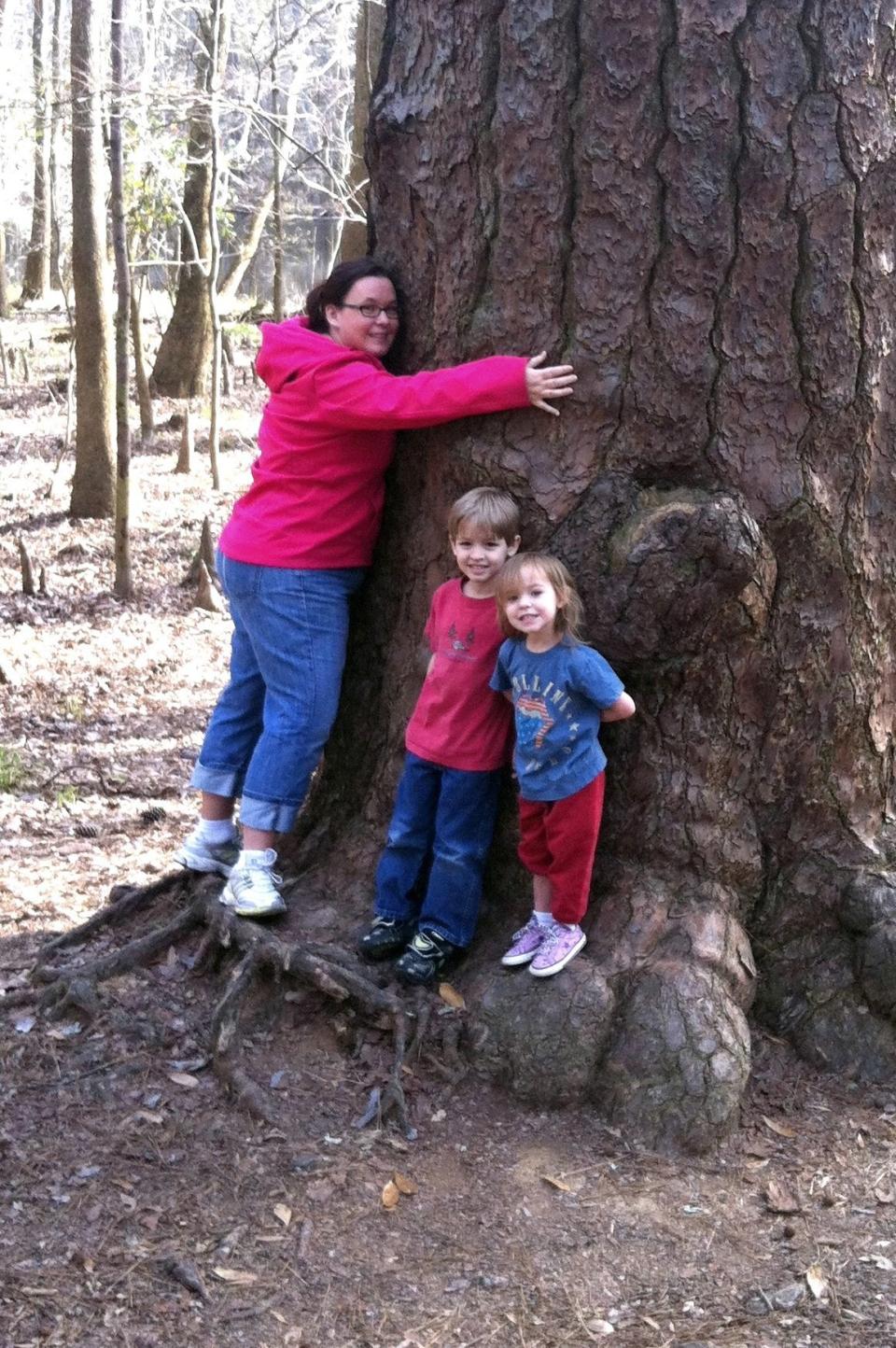 Nicole Clawson is a professional photographer. Yet she had to go back ten full months to find a single photo of herself with her kids.   